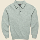 A light gray heather knit polo sweater with a three-button placket and a pointed collar.