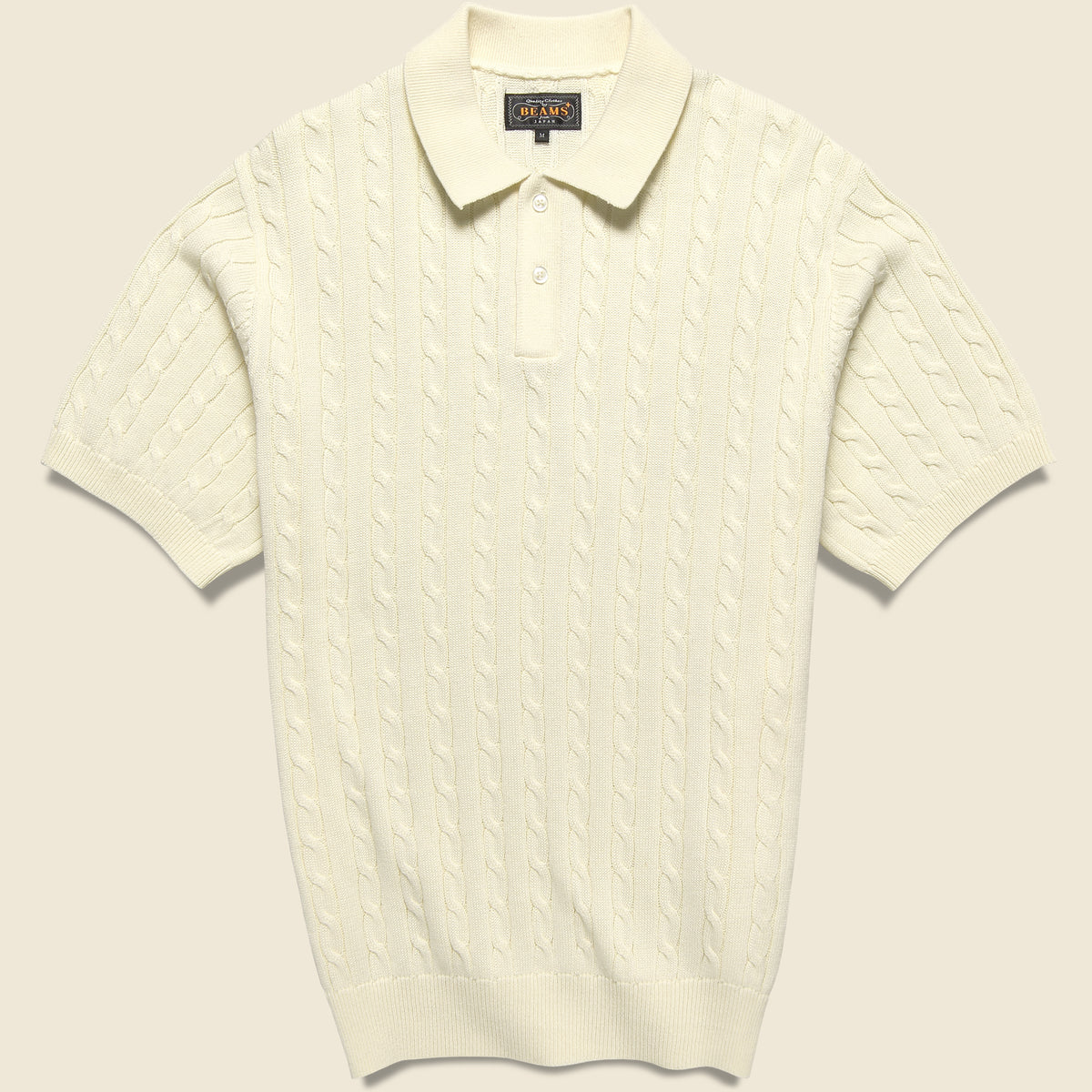 Cable Knit Polo in White featuring a textured cable-knit design and classic polo styling.